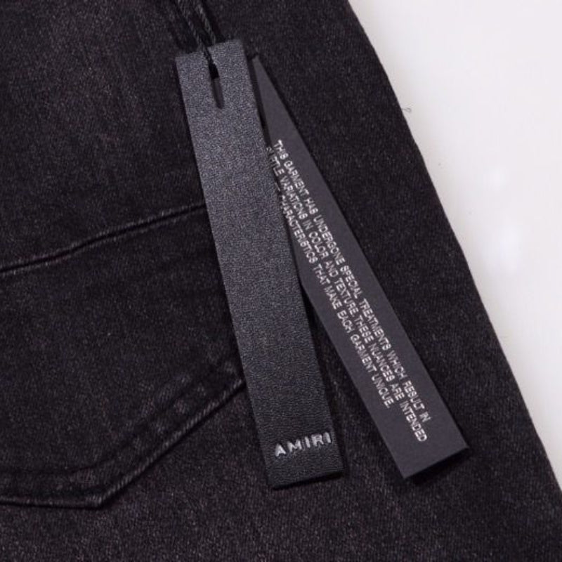 Amiri Jeans splashes ink and washes old ripped slim jeans