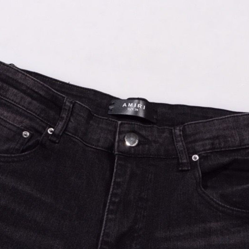 Amiri Jeans splashes ink and washes old ripped slim jeans